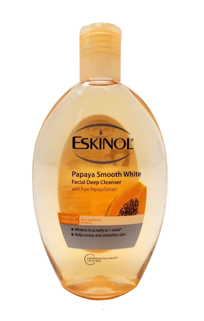 A bottle of Eskinol Papaya Smooth White Facial Deep Cleanser 225ml with a translucent amber cap and a label featuring orange papaya graphics, shown on a white background.