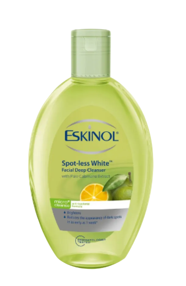 A bottle of Eskinol Spot-less White Facial Deep Cleanser 225ml with a translucent light green body and white cap, featuring citrus calamansi graphics on the label, set against a plain white background.