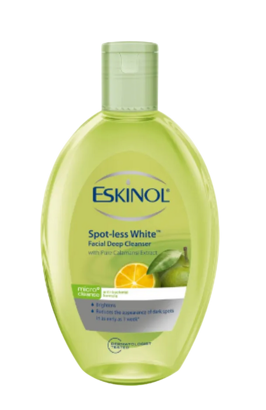 A bottle of Eskinol Spot-less White Facial Deep Cleanser 225ml with a translucent light green body and white cap, featuring citrus calamansi graphics on the label, set against a plain white background.