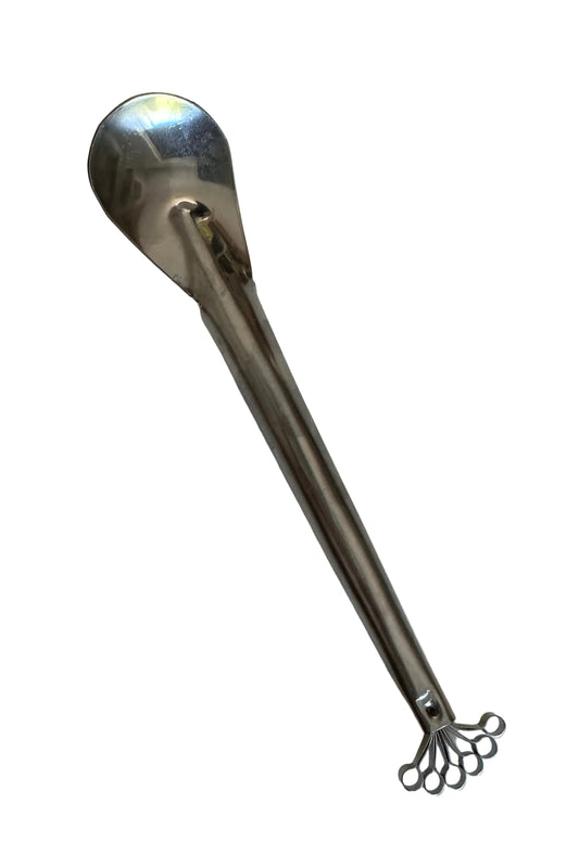 A stainless steel grater/shredder with spoon with a textured, foot-shaped handle, photographed on a plain off-white background.