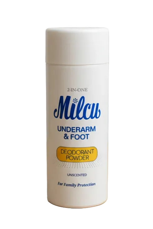 A white plastic bottle of Milcu 2-in-1 Underarm & Foot Deodorant Powder, shown on a light wooden surface against a neutral gray background.